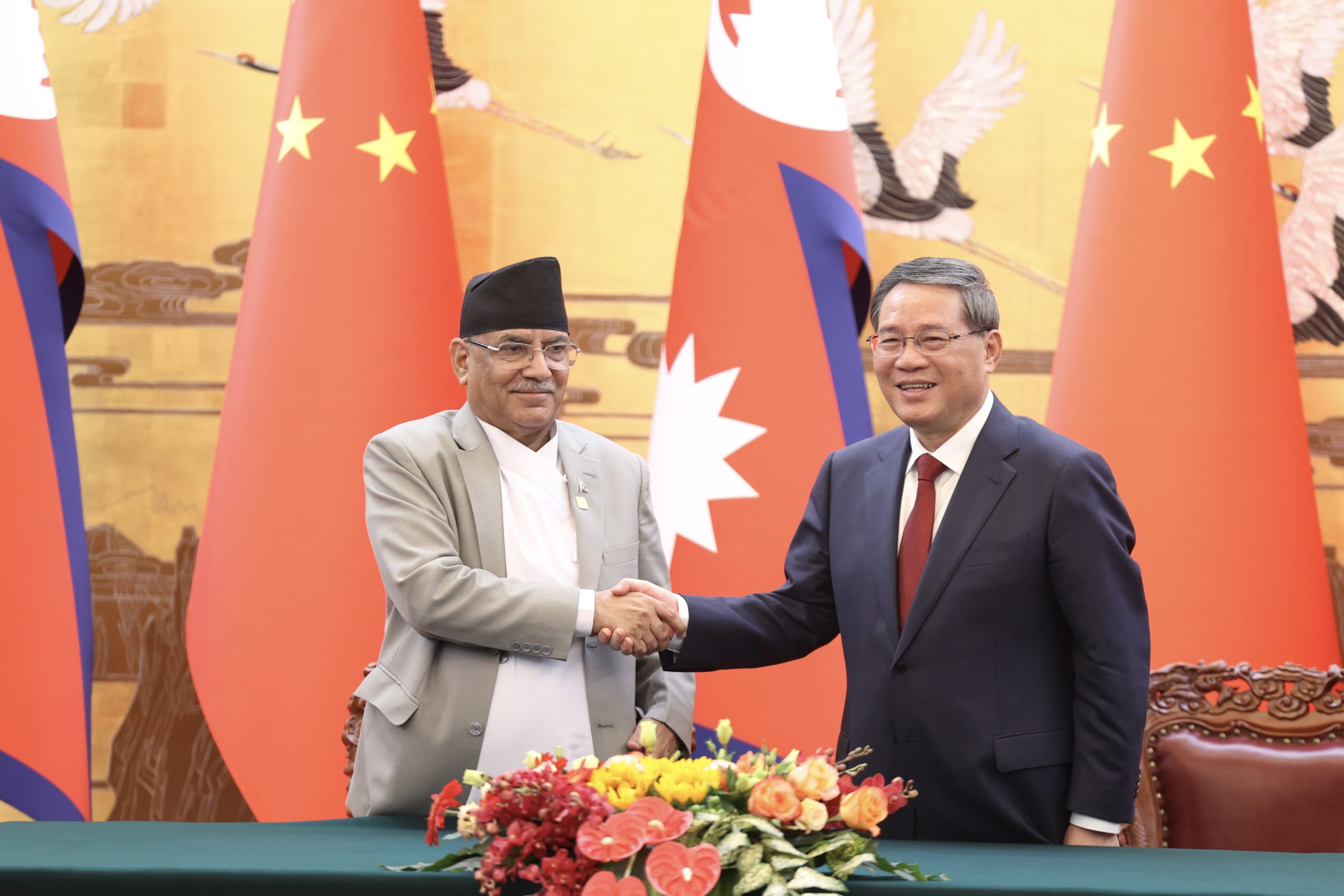 Prime Minister Pushpa Kamal Dahal of Nepal and Chinese Premier Li Qiang hold talks in Beijing's Great Hall of The People on September 25, 2023.